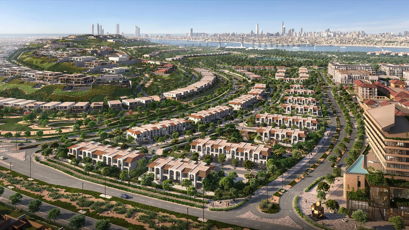 Rendering of hillside villas and townhouses on Hudayriyat Island, with the Abu Dhabi skyline behind